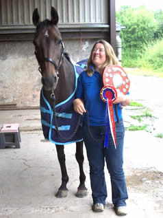 Fizz with her new rug and trophy
