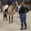 Instructor and students on horses